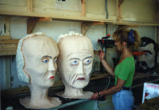 Giant heads being painted